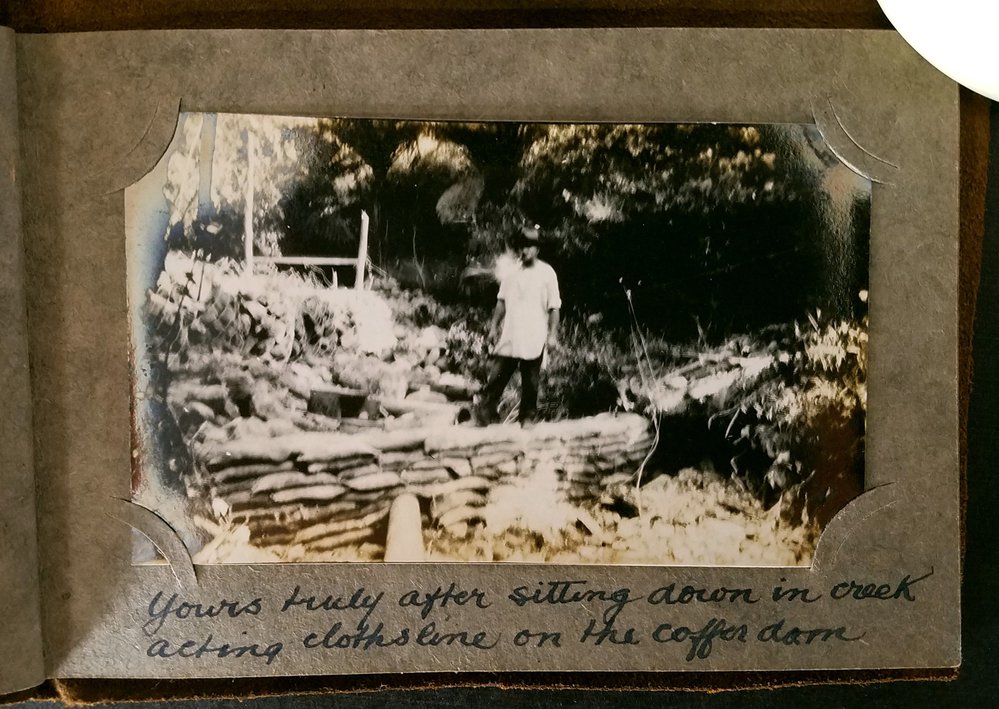 Possibly Ben Keys standing near gabion wall.