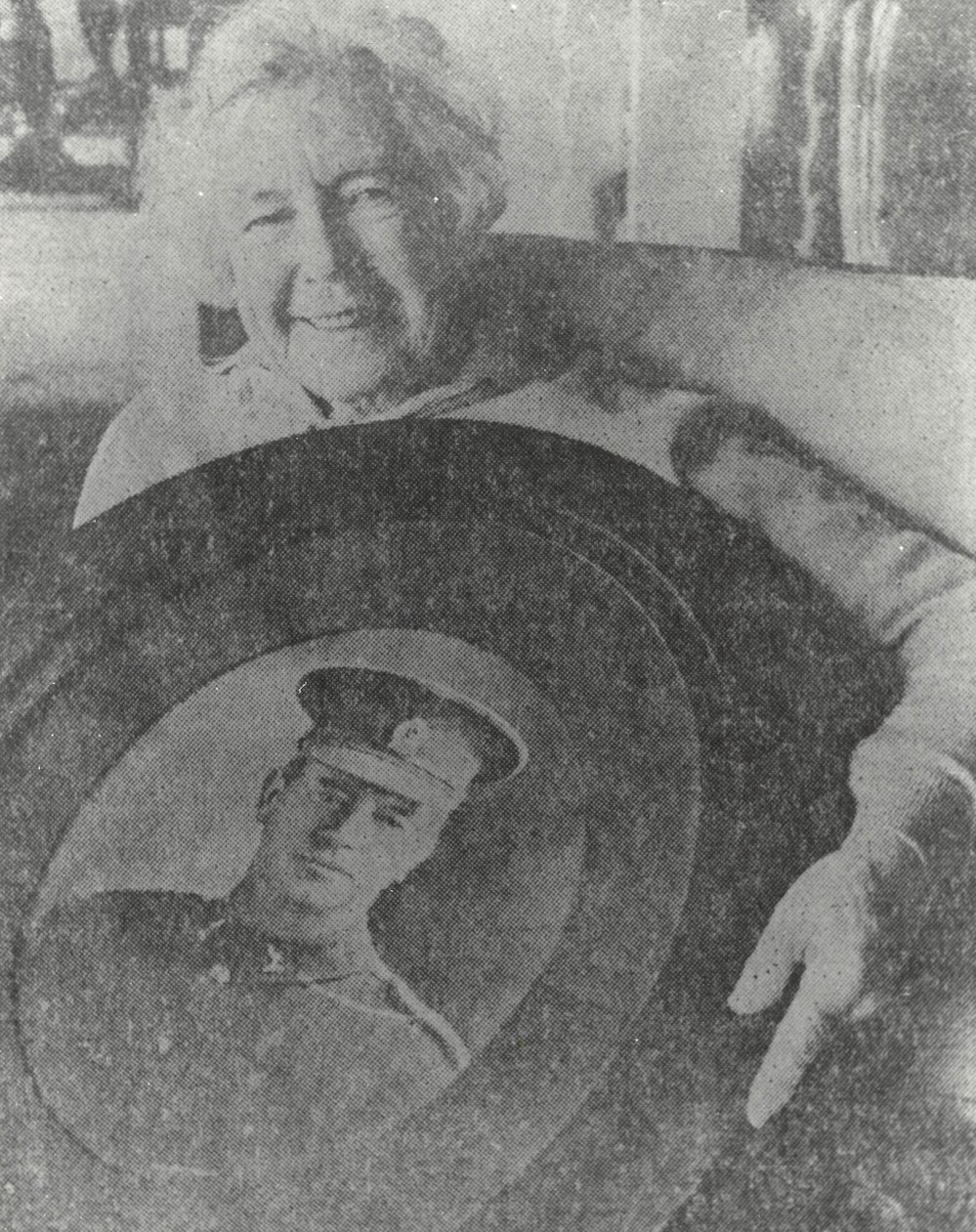 Nora Simpson with a portrait of her father David Gallaher