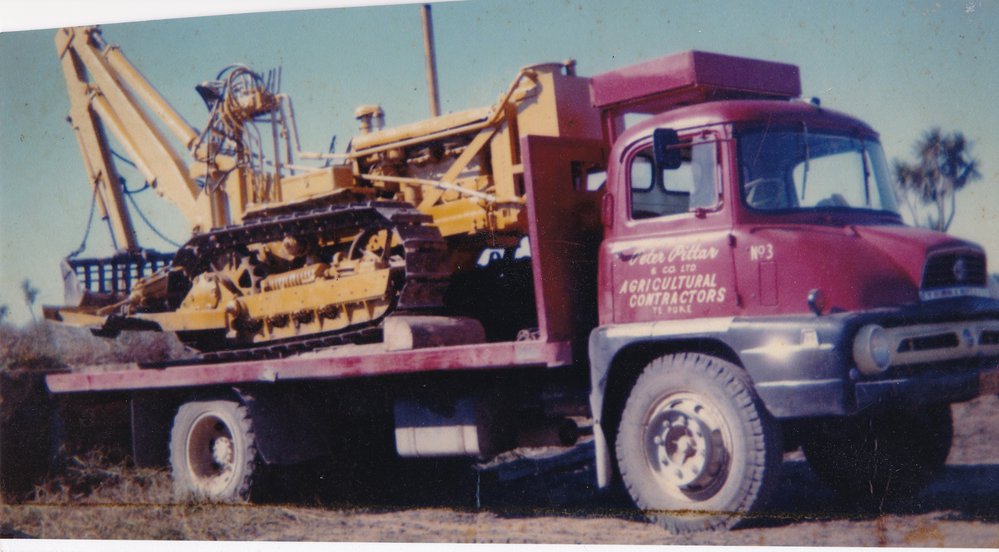 Truck and digger in use by Peter Pittar &amp; Co. Ltd.