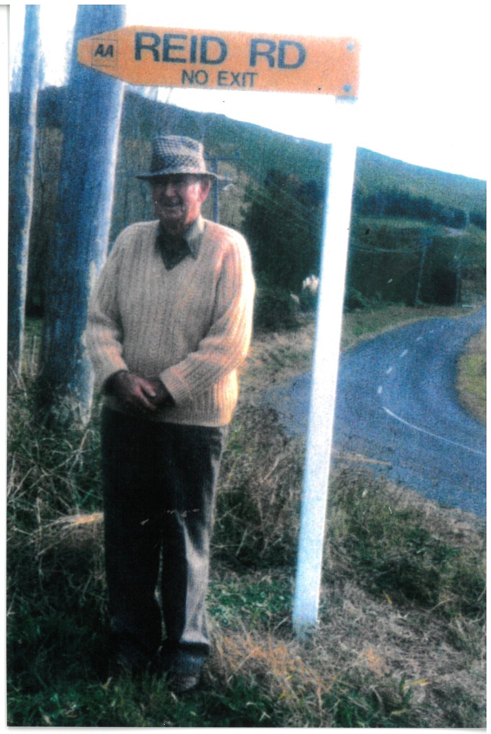 Don Reid at the entrance to Reid Road