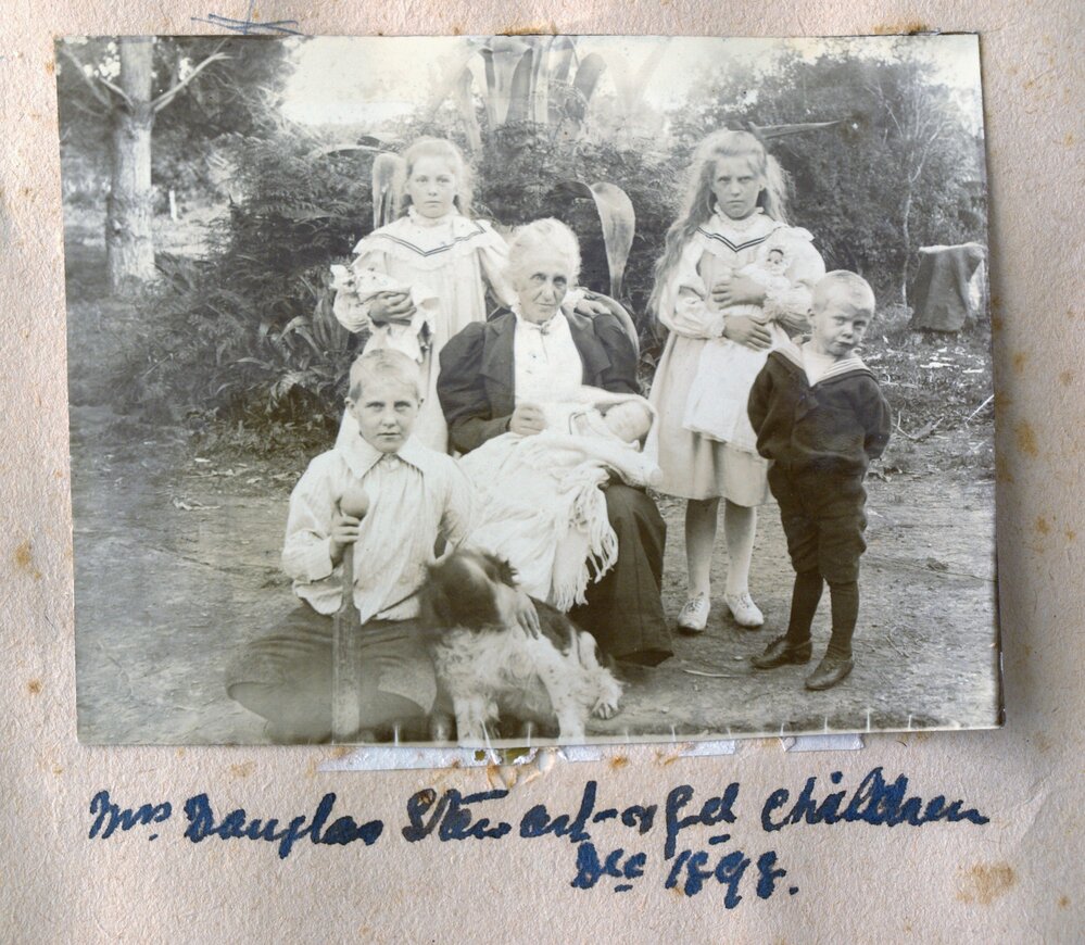 Julia Stewart with five grandchildren and dog