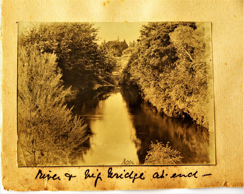 Scenic view of the Waiau River with a bridge in the distance