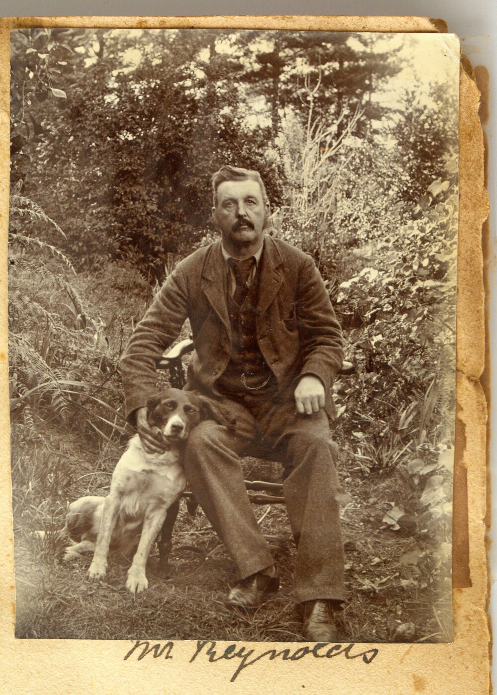 John Reynolds with his dog at Katikati.