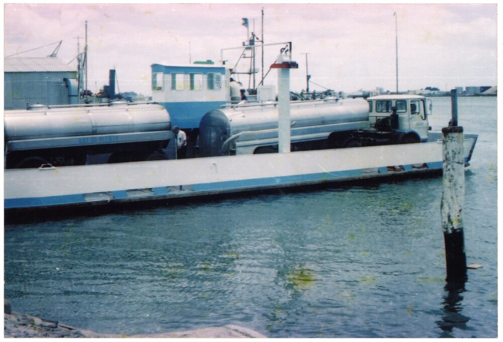 A milk tanker being transported to Matakana Island by barge from Ōmokoroa