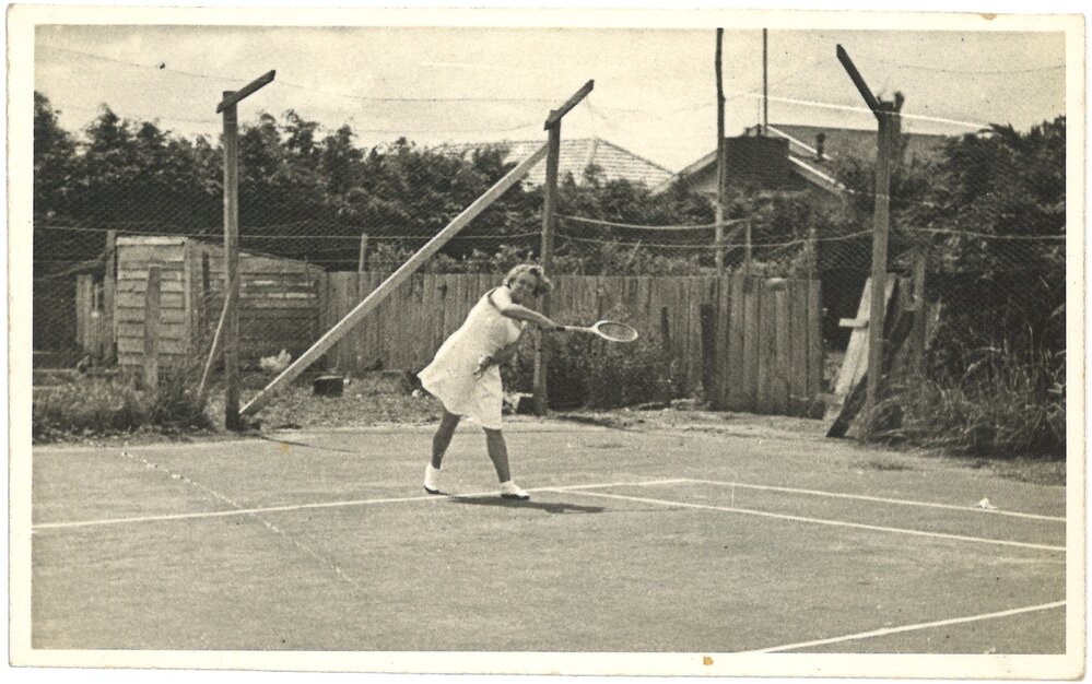 Betty Brake playing tennis in Katikati
