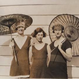 Three Ladies with Japanese umbrellas at Waihi Beach