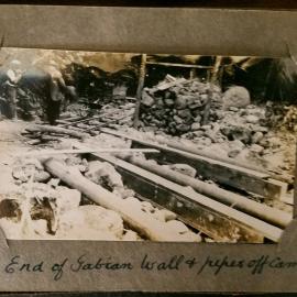 End of gabion wall & pipes off camel back.