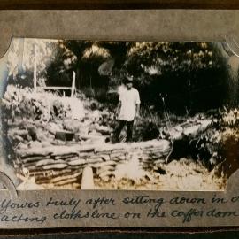 Possibly Ben Keys standing near gabion wall.