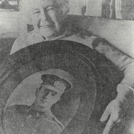 Nora Simpson with a portrait of her father David Gallaher