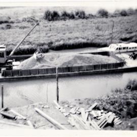 Barge with metal chips from Wharawhara Road Quarry