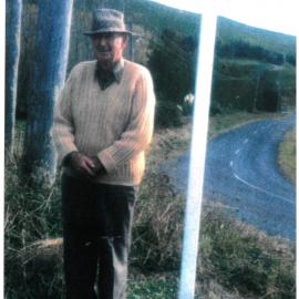Don Reid at the entrance to Reid Road