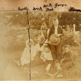 Buckworth family in front of a wire fence