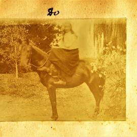 Evyleen Stewart sitting side saddle on Pharoah the horse