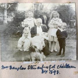 Julia Stewart with five grandchildren and dog