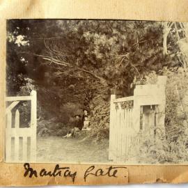 The gate into Martray House with the family and Prince the dog