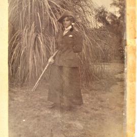 Woman holding a gun at Katikati.