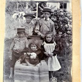 Hugh and Susan Stewart's children wearing straw boaters.