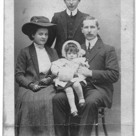 Little Rita Mountier with her parents and uncle (?)