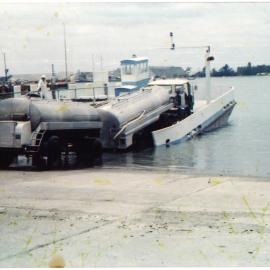 A milk tanker boarding the Ōmokoroa-Matakana Island barge