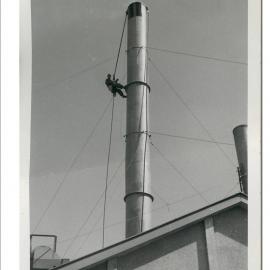 Norman Kirk painting chimney