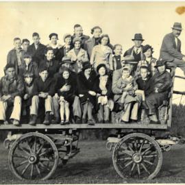 Group of hunt watchers on a wagon, 1936.