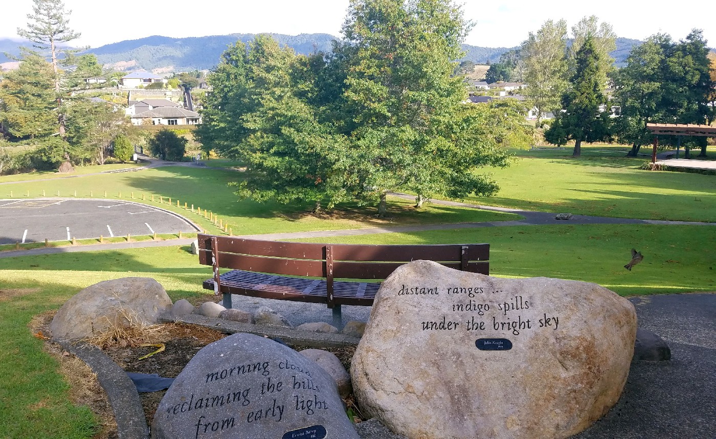Overlooking the Uretara Reserve and Haiku Walk with Haiku poems in the foreground.